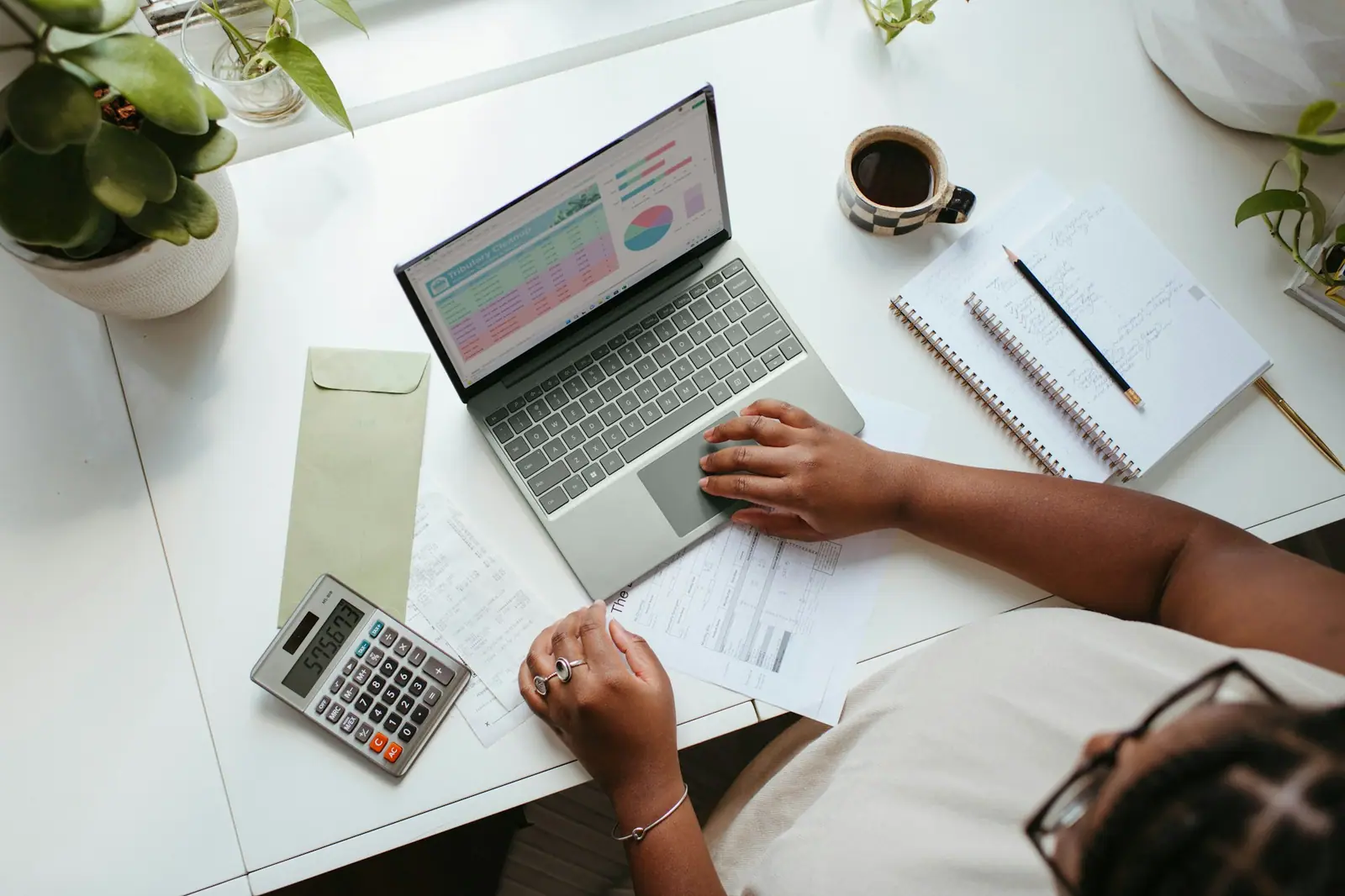 A business planning desk with notes, illustrating category-led procurement planning.